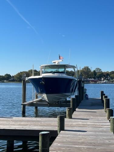 Tiara Yachts 38 LS 2021 Tiara Yachts 38 LS docked at a serene waterfront pier.