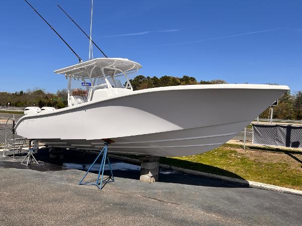 Yellowfin 32 2025 Yellowfin 32 boat on display, white hull, clear sky background.