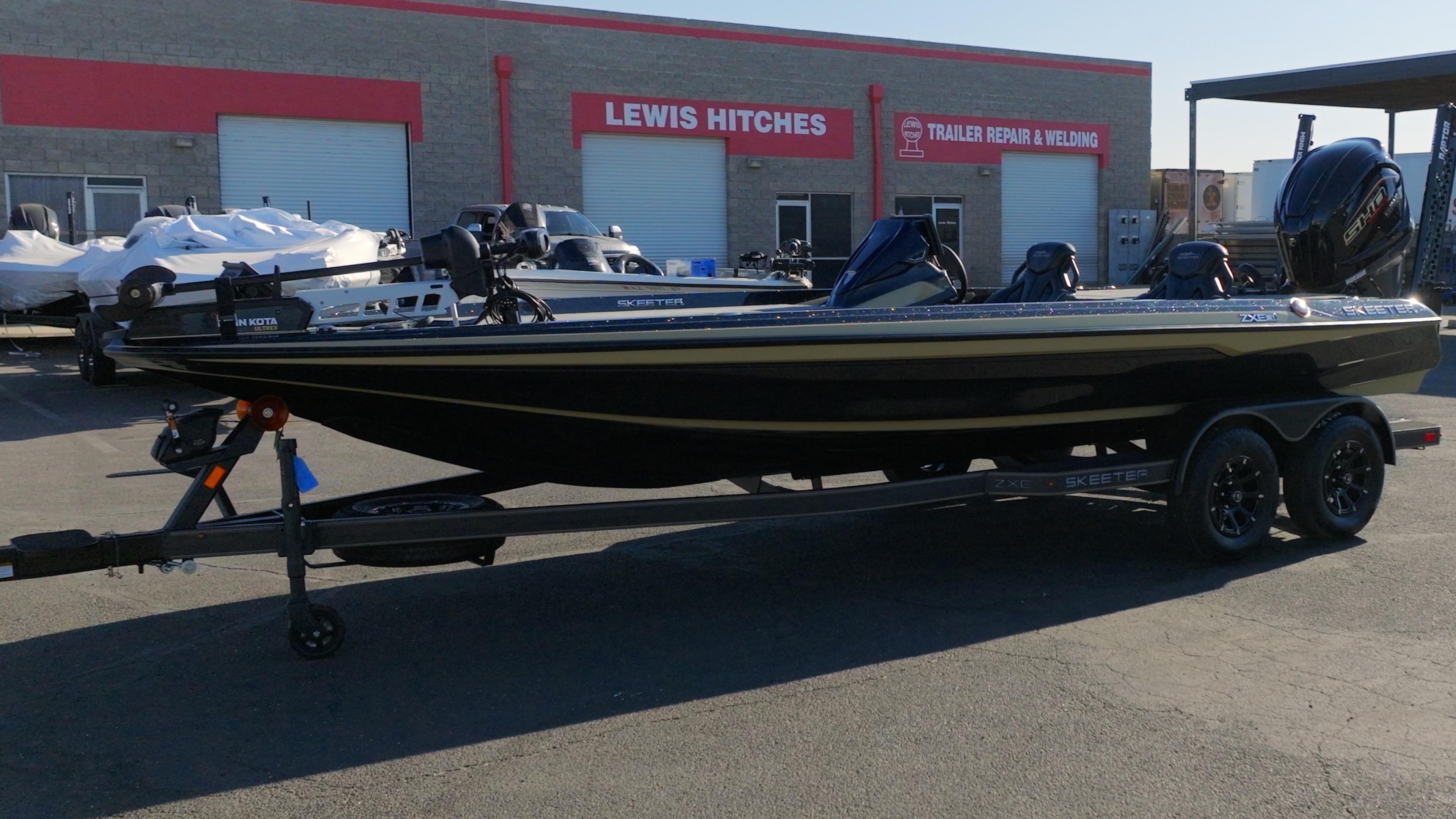 Skeeter ZXE21 2026 Skeeter ZXE21 boat on trailer outside Lewis Hitches store.