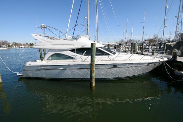 Maxum 4600 SCB 2001 Maxum 4600 SCB yacht docked in marina, side view.
