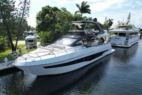 Astondoa Flybridge 2024 Astondoa Flybridge yacht docked in a serene marina.
