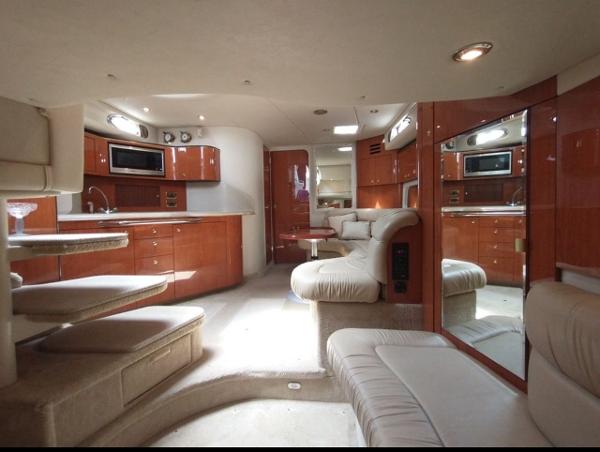 Sea Ray 380 Sundancer Luxurious interior of 2001 Sea Ray 380 Sundancer yacht with modern kitchen and seating area.