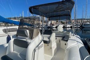 BSC BSC 78 2018 BSC 78 boat with canopy, docked in marina, surrounded by other boats.