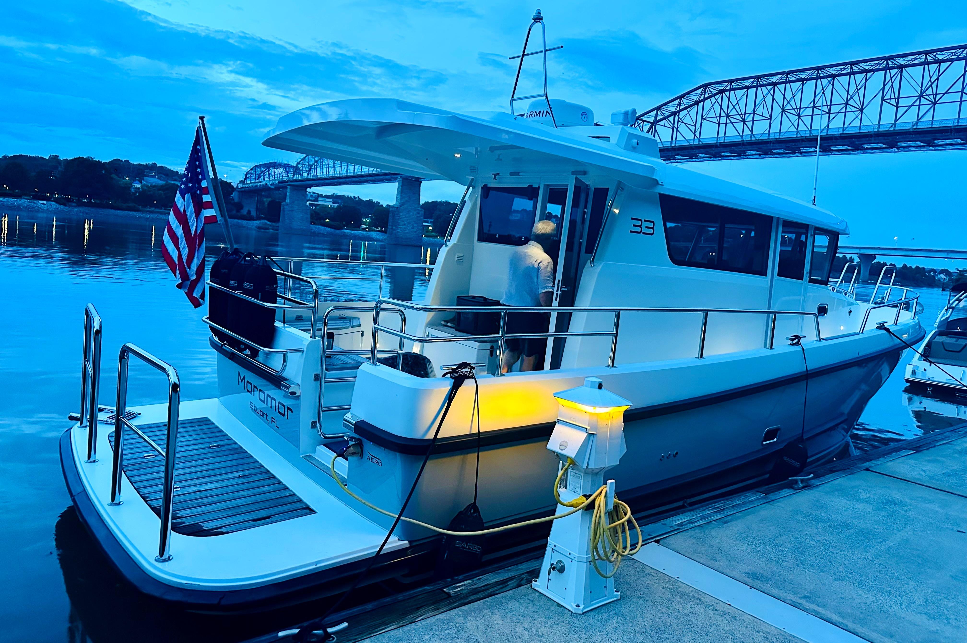 Sargo 33 All Season 2019 Sargo 33 All Season boat docked at sunset with American flag.