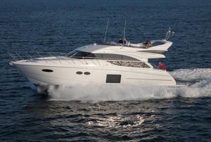 Princess 56 Flybridge Motor Yacht 2013 Princess Flybridge 56 Motor Yacht cruising on open water.