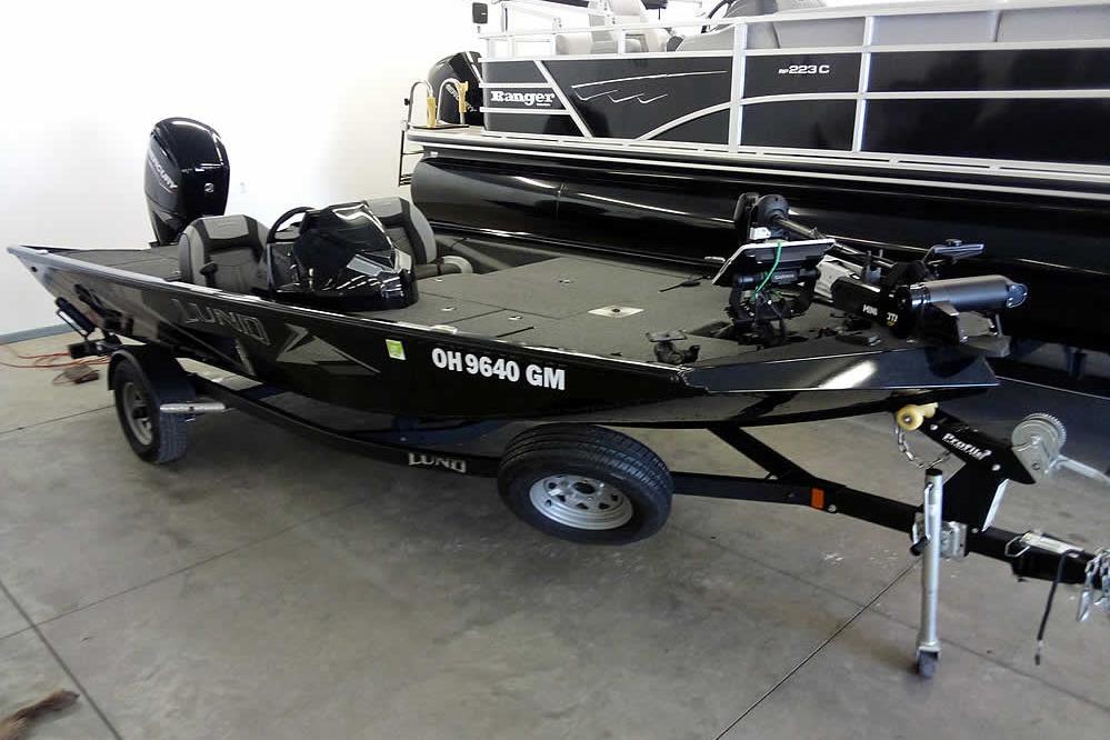 Lund 1775 Renegade 2024 Lund 1775 Renegade fishing boat on trailer in showroom.