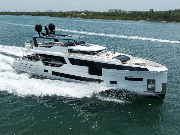 Sirena 88 2024 Sirena 88 yacht cruising on a serene waterway.