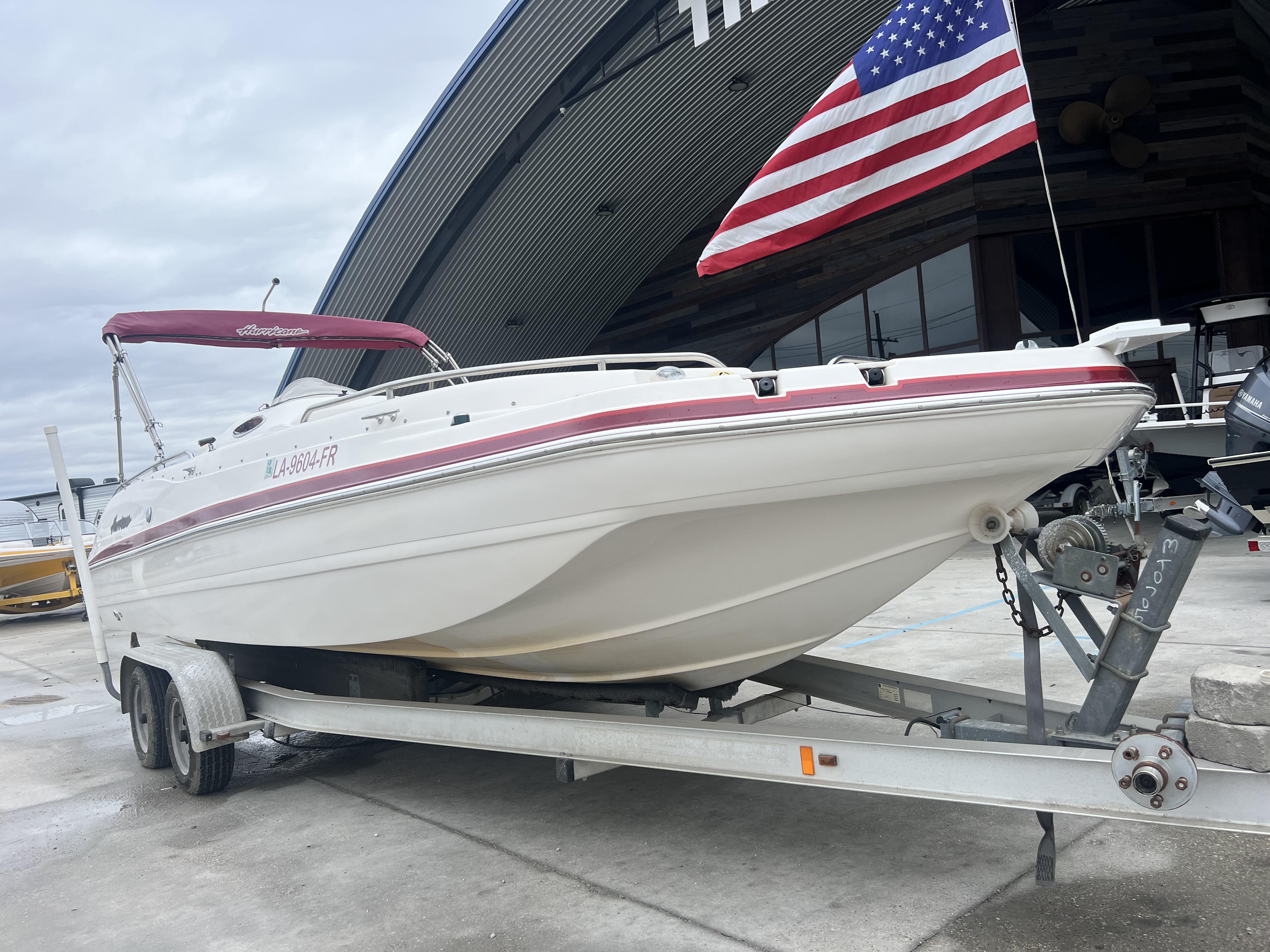 Hurricane 237 2005 Hurricane 237 boat on trailer with American flag.