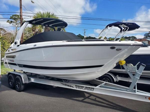 Monterey 255SS 2024 Monterey 255SS boat on trailer, white hull, black accents, outdoor display.