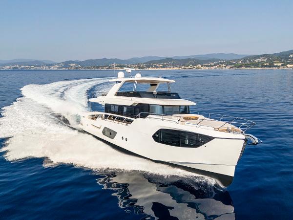 Absolute 70 Navetta Co Ownership Luxury Absolute 70 N yacht cruising on open water, 2026 model, fractional ownership.