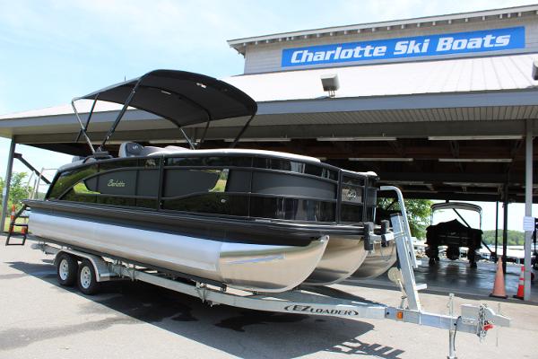 Barletta Lusso 23M 2025 Barletta Lusso 23M pontoon boat on trailer at Charlotte Ski Boats dealership.