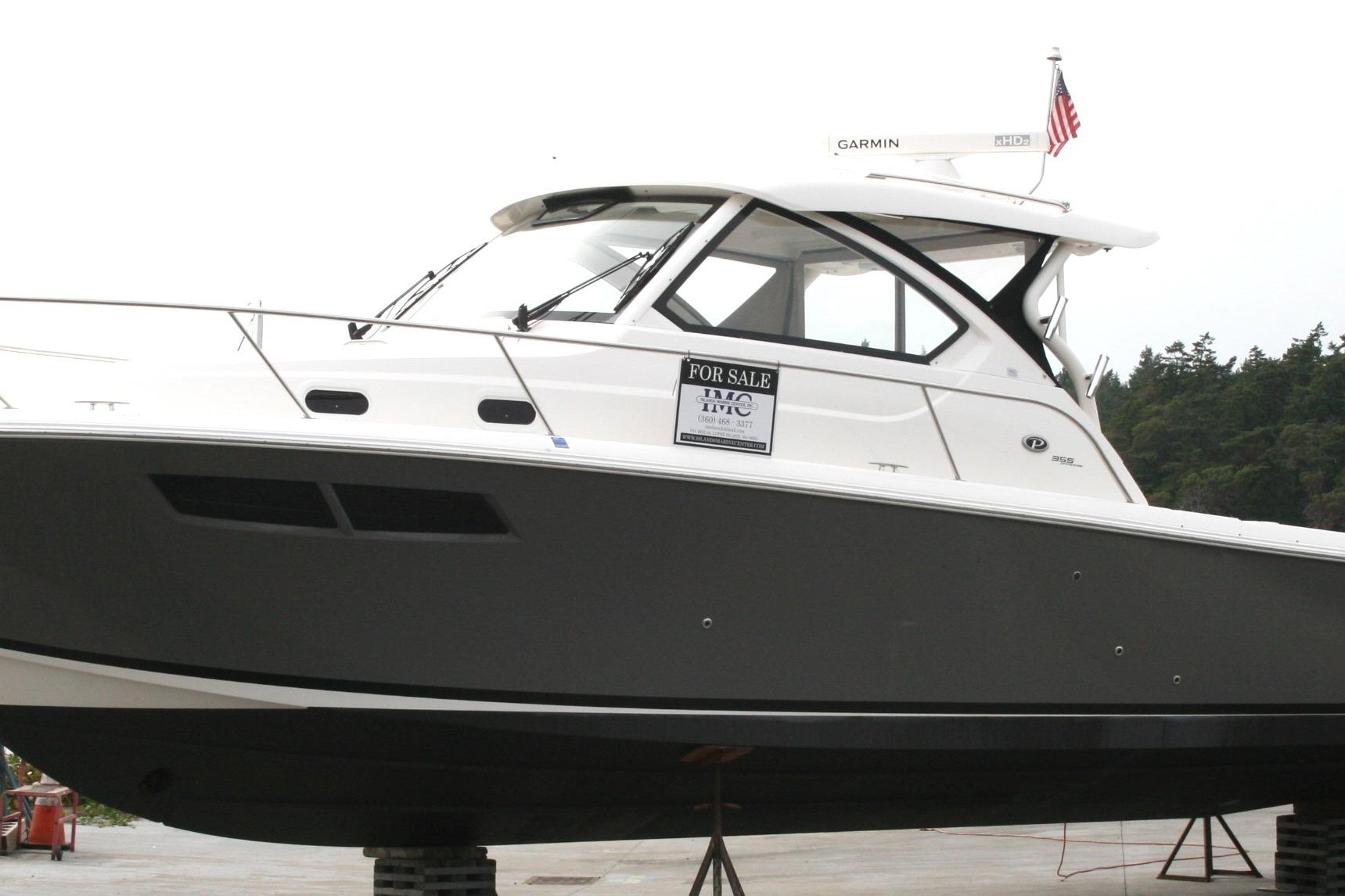 Pursuit OS 355 Offshore 2020 Pursuit OS 355 Offshore boat for sale, displayed on a stand.
