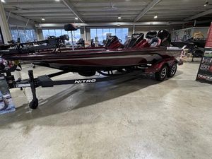 Nitro Z21 XL 2025 Nitro Z21 XL boat in showroom, sleek design, dual seats, trailer included.