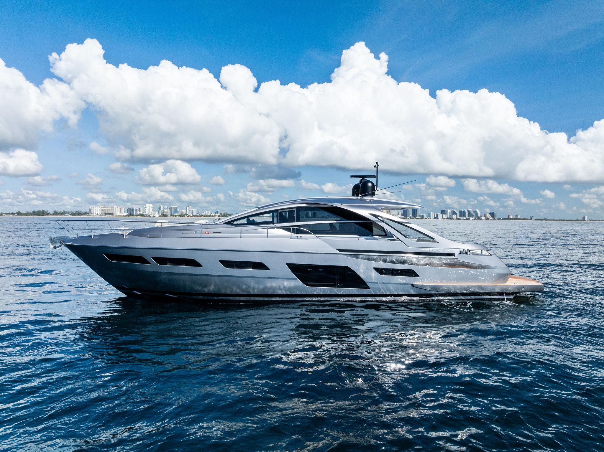 Pershing 7X 2025 Pershing 7X yacht cruising on open water under a clear blue sky.