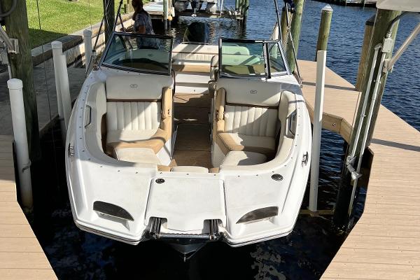 Cobalt 25SC 2020 Cobalt 25SC boat docked, featuring spacious seating and sleek design.