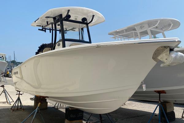 Sea Pro 239 2023 Sea Pro 239 boat on stands in a marina.