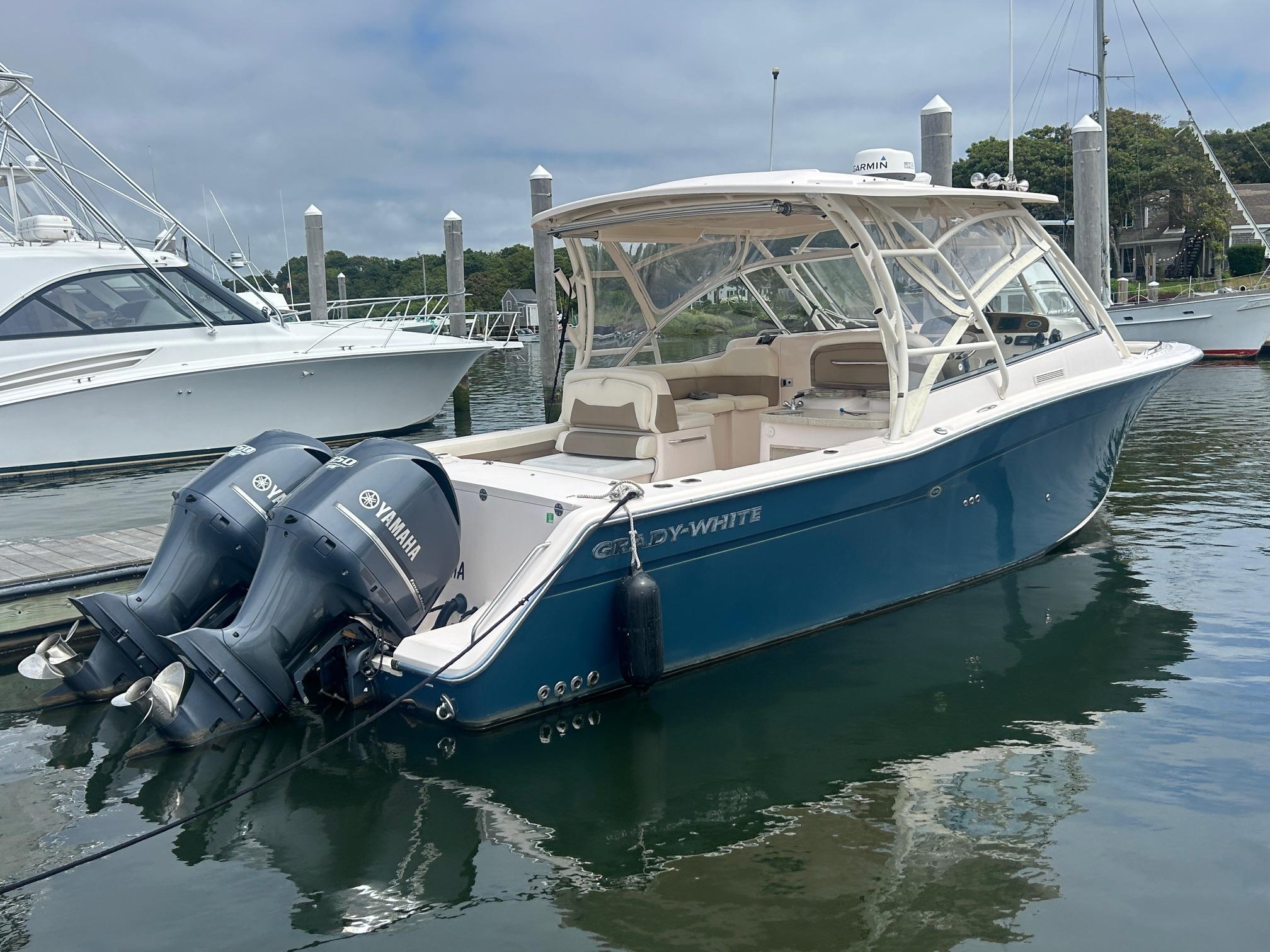 Grady-White Freedom 335 2013 Grady-White Freedom 335 boat with Yamaha engines docked in marina.