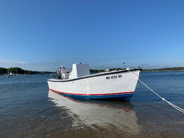 Custom 20 Center Console 2020 ROS Boats 20 Center Console moored in calm waters under clear blue sky.