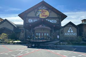 Tracker Pro Team 175 2026 Tracker Pro Team 175 boat outside Bass Pro Shops store.