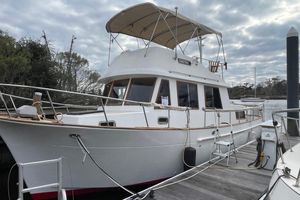 Marine Trader 34 Double Cabin 1991 Marine Trader 34 Double Cabin yacht docked under cloudy skies.