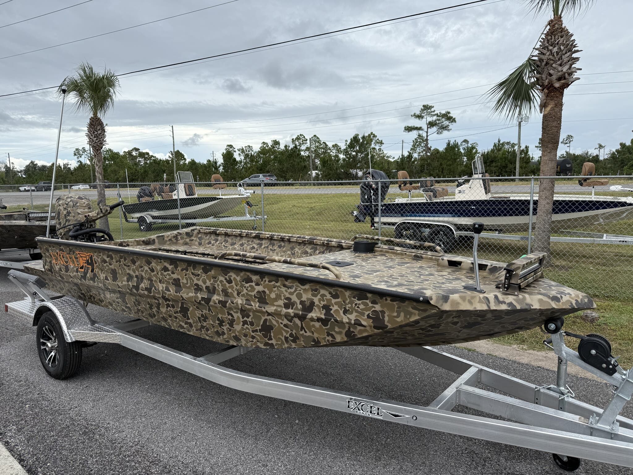 Excel Viper F4 1751-YAMHA 60 Camouflage Excel Viper F4 1751-YAMHA 60 boat on trailer, 2026 model, parked outdoors.