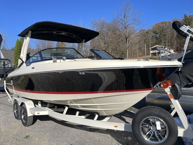 Chris-Craft Sportster 25 2025 Chris-Craft Sportster 25 boat on trailer, black and white design, parked outdoors.