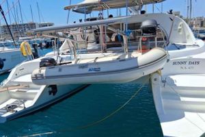 Lagoon 380 S2 2013 Lagoon 380 S2 catamaran "Sunny Days" docked with tender boat.