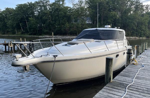 Tiara Yachts 4300 Sovran 2006 Tiara Yachts 4300 Sovran docked by a wooded shoreline.