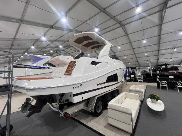 Ventura DayCruiser 2025 Ventura DayCruiser boat displayed indoors with modern seating arrangement.