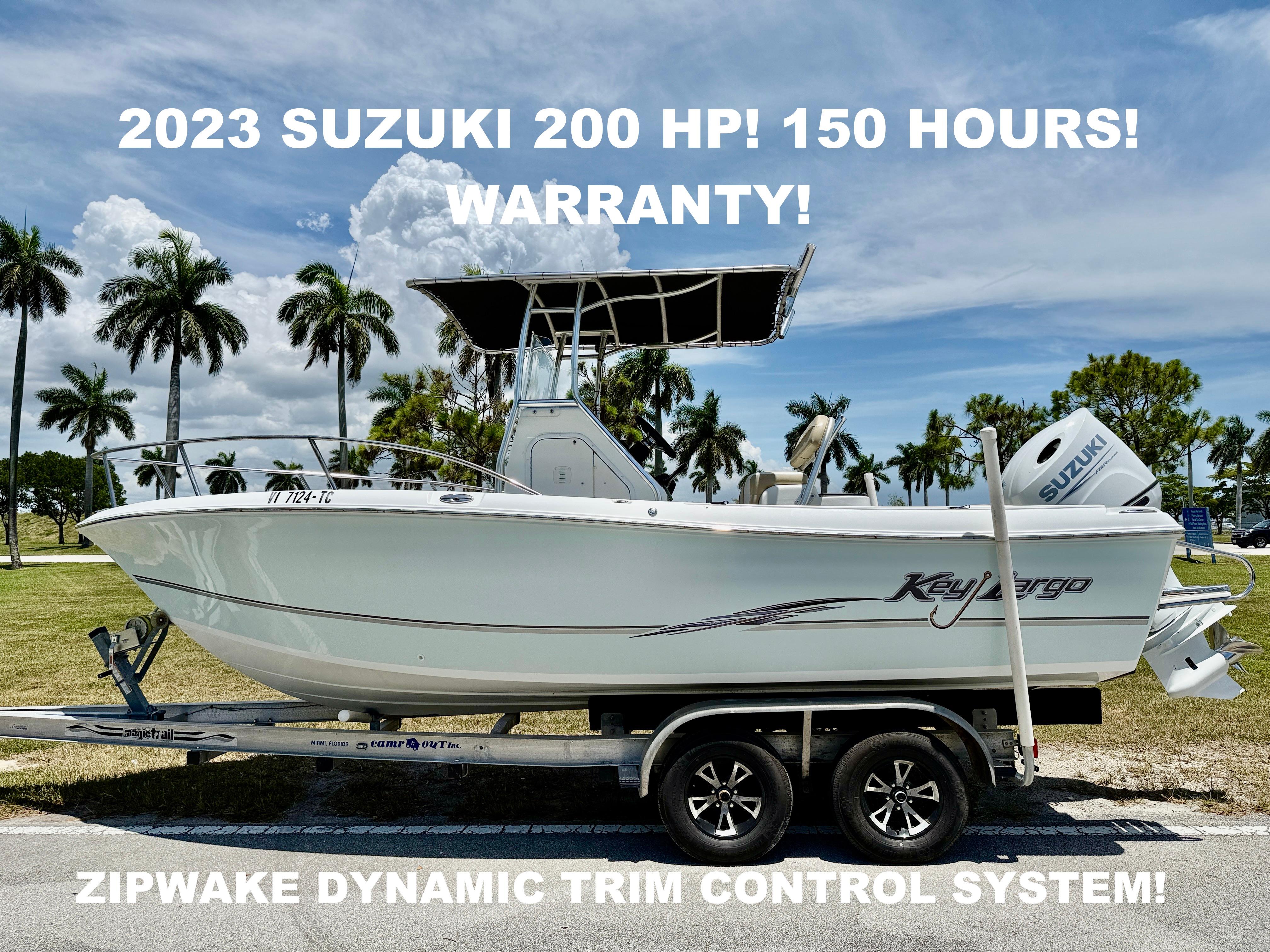 Key Largo 2100 WI CC 2016 Key Largo 2100 WI CC boat with 2023 Suzuki 200 HP engine, on trailer.