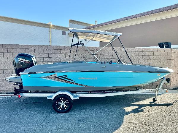 Bayliner Element E18 2022 Bayliner Element E18 boat with trailer, blue exterior, parked outdoors.