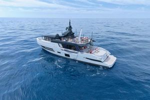 Arcadia Yachts Sherpa 80 XL 2024 Arcadia Yachts Sherpa 80XL cruising on open sea under clear skies.