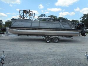 Starcraft CX 25 DL BAR 2024 Starcraft CX 25 DL BAR pontoon boat on a trailer.