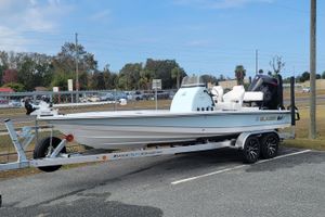 Blazer 675 Ultimate Bay 2026 Blazer 675 Ultimate Bay boat on trailer in parking lot.