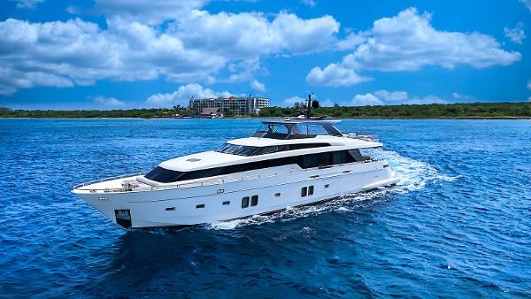 Sanlorenzo SL104 Luxurious 2014 Sanlorenzo SL104 yacht cruising on vibrant blue ocean waters.