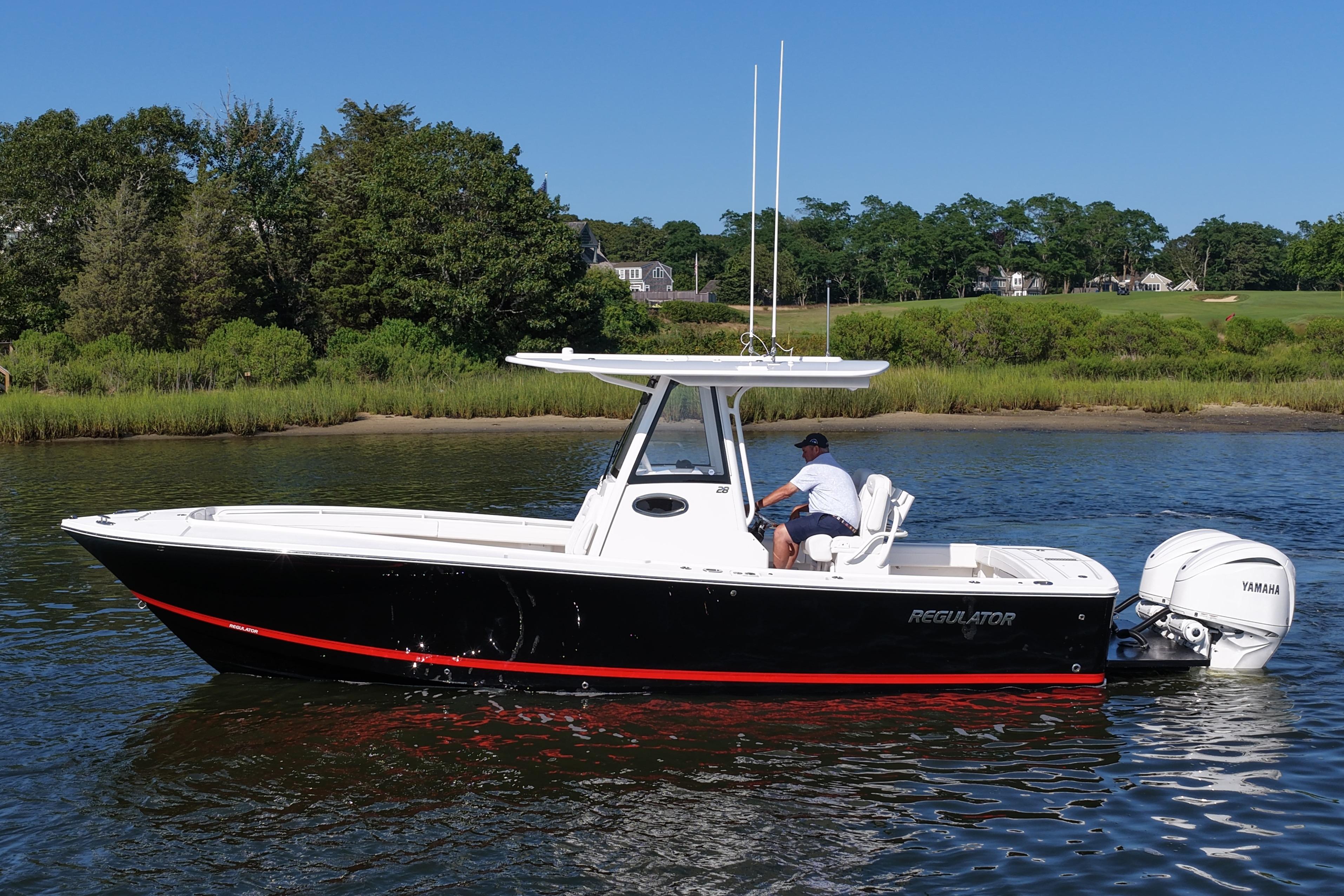 Regulator 28 2025 Regulator 28 boat on water, featuring sleek design and Yamaha engines.