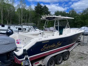 Pursuit 3070 Center Console 2001 Pursuit 3070 Center Console boat on trailer, surrounded by trees and RVs.