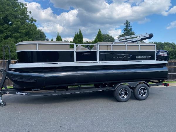 Ranger Reata 200C 2024 Ranger Reata 200C pontoon boat on trailer, parked outdoors.