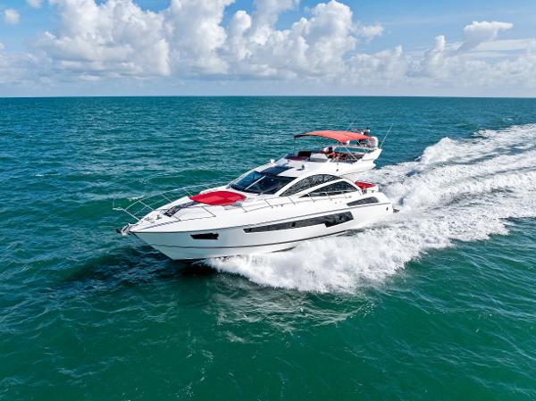 Sunseeker 68 Sport Yacht 2014 Sunseeker 68 Sport Yacht cruising on open sea under clear skies.