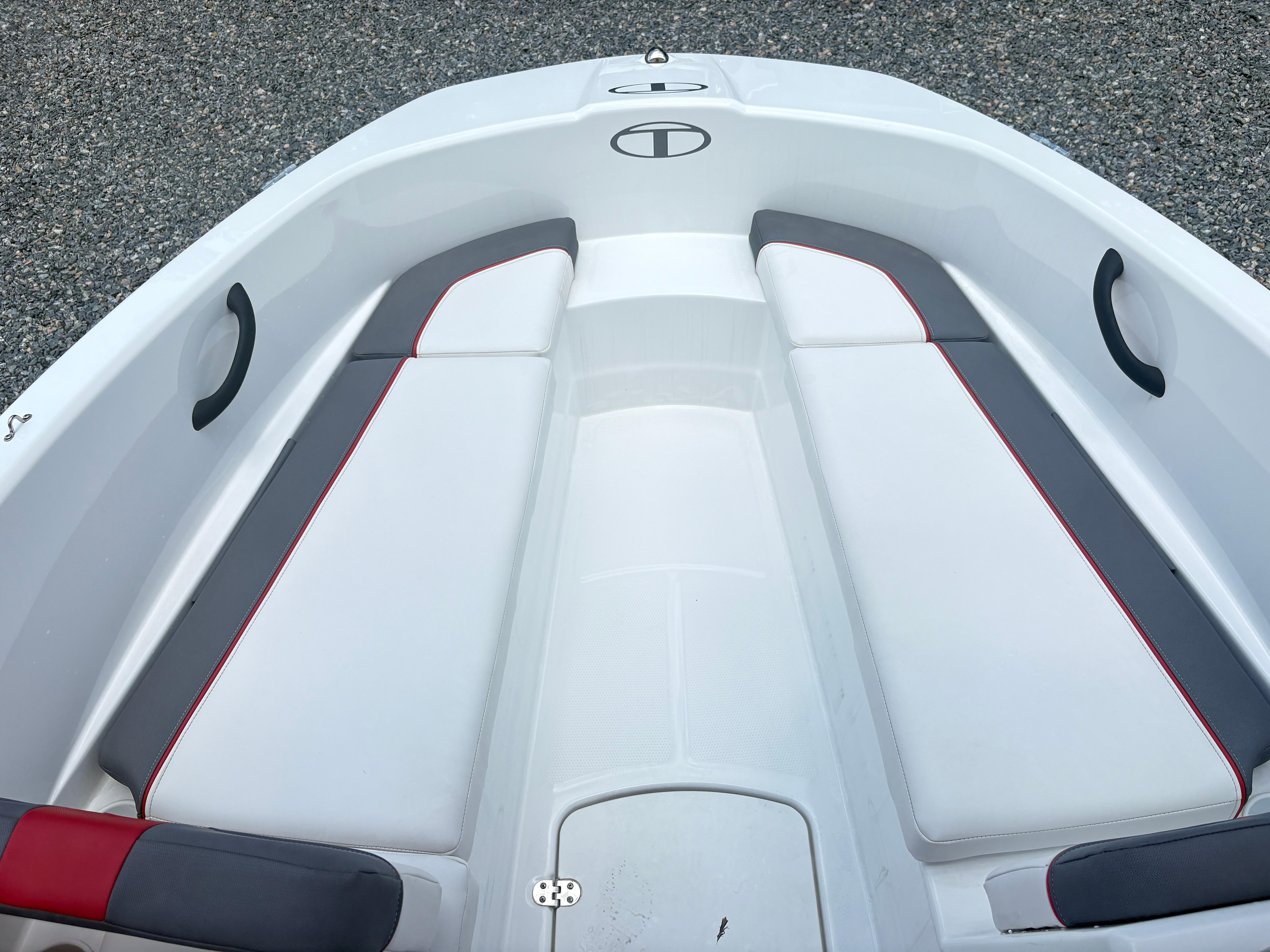 Tahoe T16 2021 Tahoe T16 boat interior with white and gray seating, red accents.