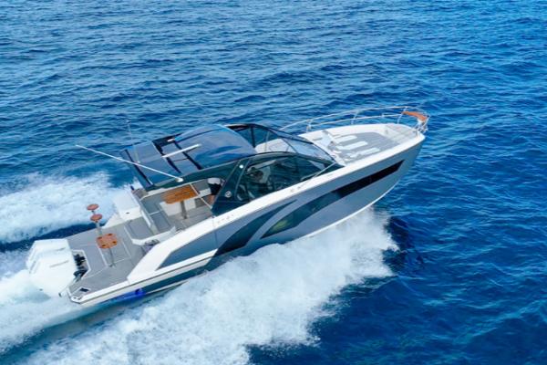 Hanover 387 Gray & Black Edition Outboard 2025 Hanover 387 Grey & Black Edition Outboard cruising on open blue water.
