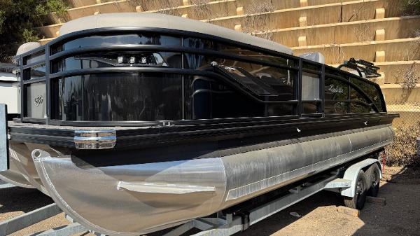 Barletta Corsa 23UC 2024 Barletta Corsa 23UC pontoon boat on trailer, sleek black design.