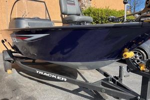 Tracker Pro Guide V-16 WT 2026 Tracker Pro Guide V-16 WT boat on trailer, side view.