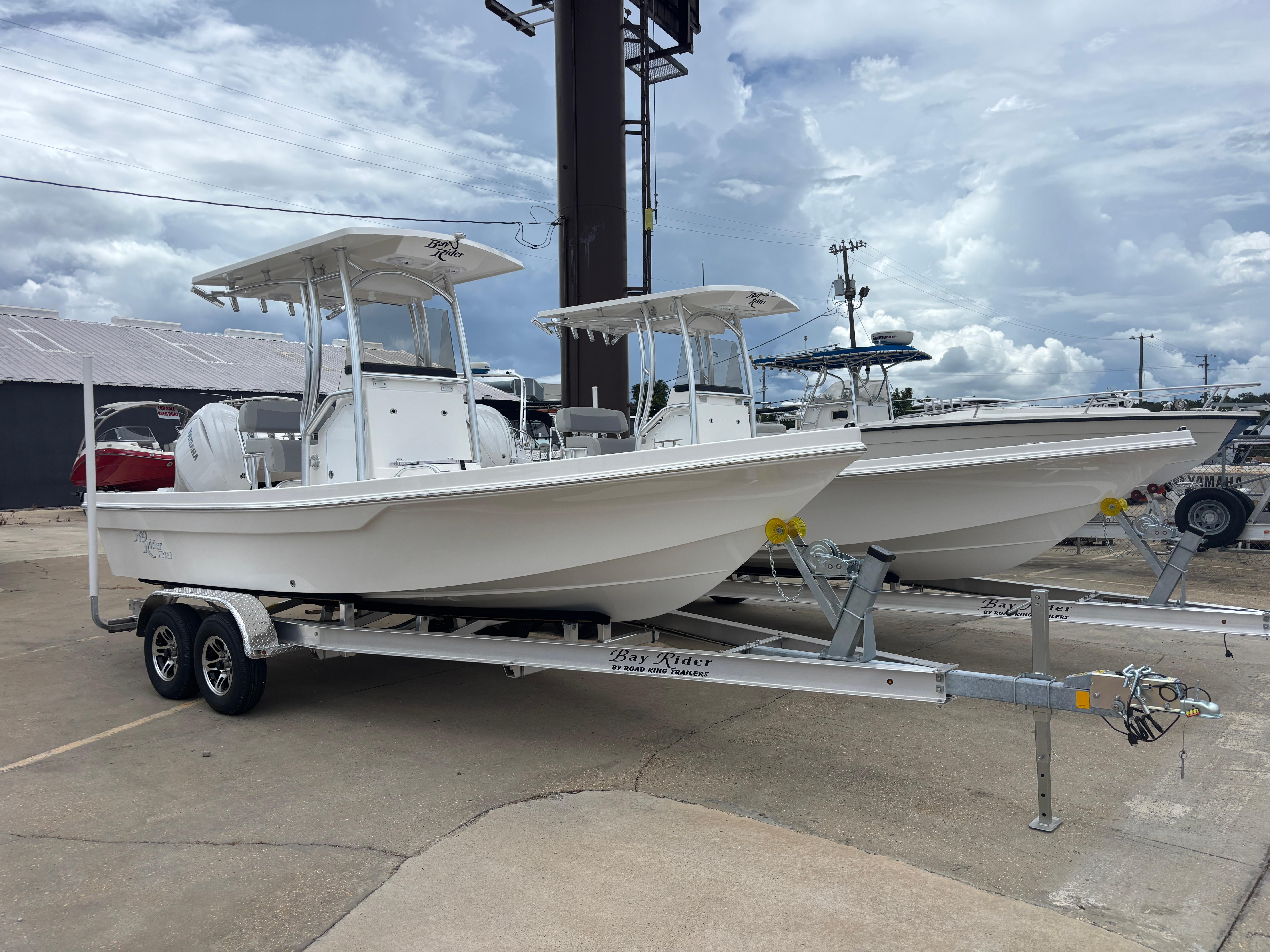 Bay Rider 219 Bay 2026 Bay Rider 219 Bay boats on trailers under cloudy sky.