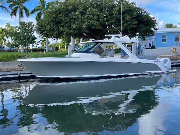 Tiara Yachts 38 LS 2020 Tiara Yachts 38 LS docked in a marina with palm trees in the background.