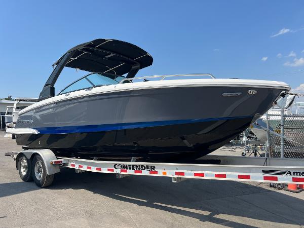 Chaparral 270 OSX 2024 Chaparral 270 OSX boat on a trailer in a marina.
