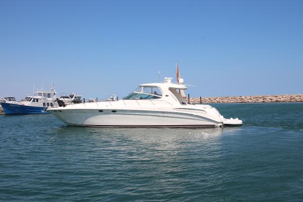 Sea Ray 550 Sundancer 2003 Sea Ray 550 Sundancer yacht cruising on calm waters under a clear blue sky.