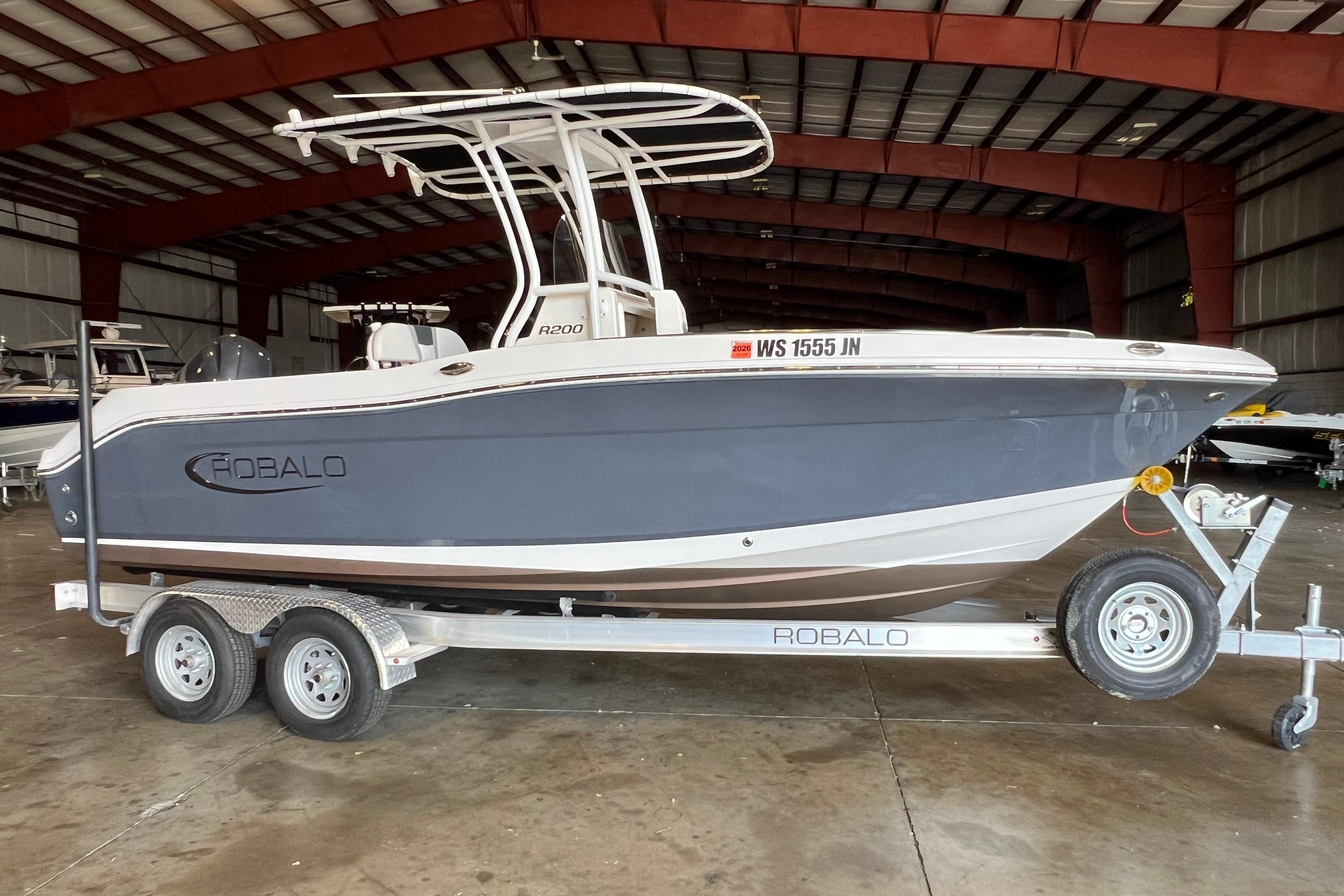 Robalo R200 Center Console 2023 Robalo R200 Center Console boat on trailer in indoor storage facility.