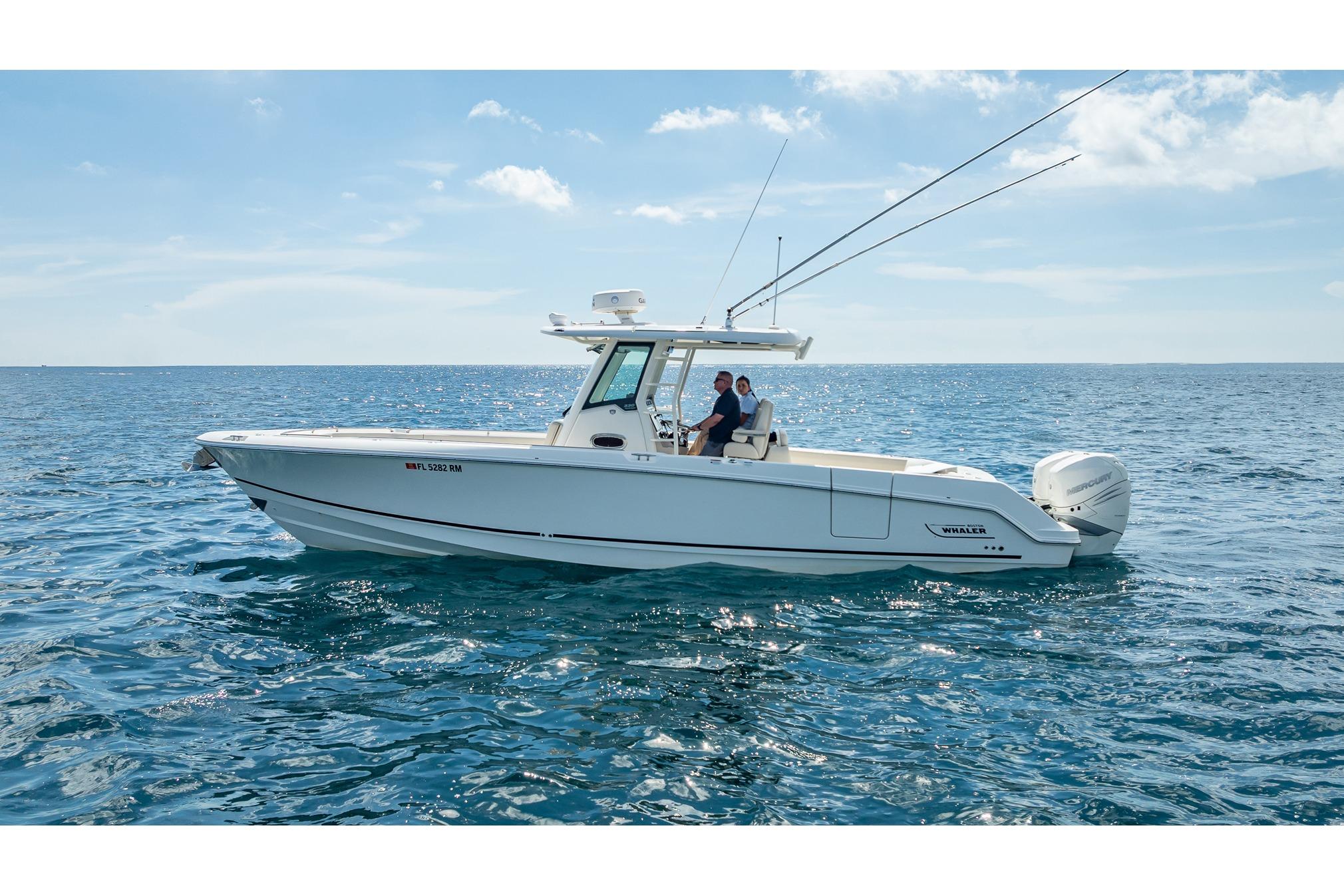 Boston Whaler 330 Outrage 2017 Boston Whaler 330 Outrage boat cruising on open sea under clear sky.