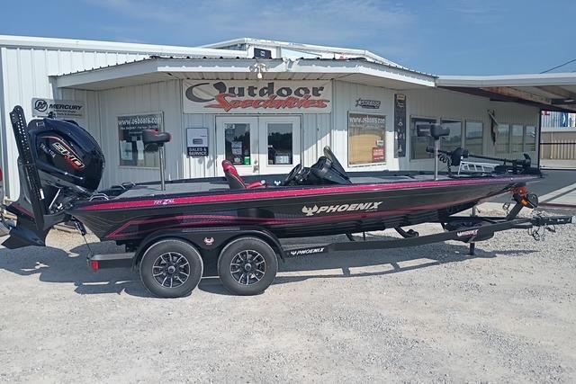 Phoenix 721 ZXL 2026 Phoenix 721 ZXL boat on trailer outside Outdoor Specialties store.
